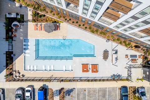 Aerial view of Anchor apartment pool with lounge seating and resort-style amenities