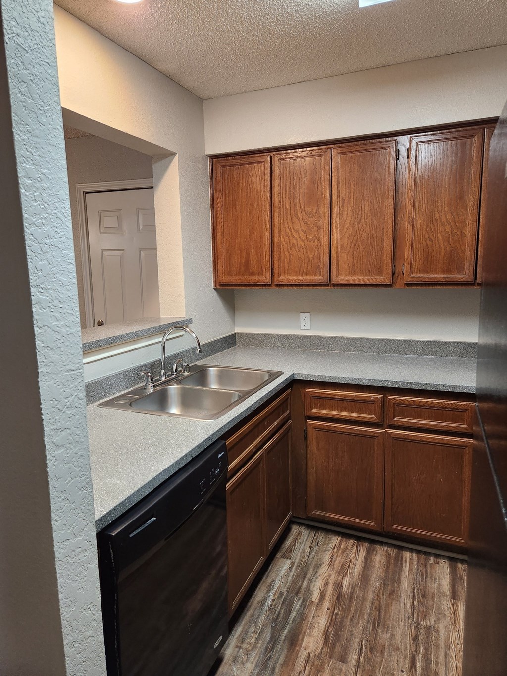 Delmar Villas Kitchens a kitchen with a sink and a dishwasher