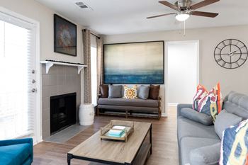 Spacious living room with wood-inspired flooring