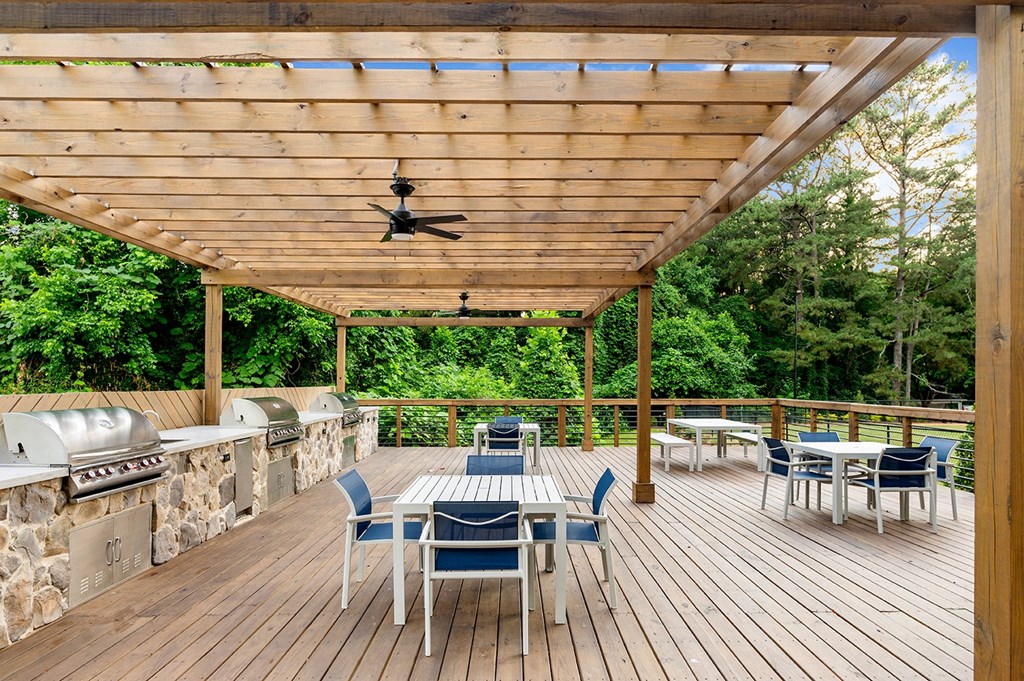 Patio with grills, tables and chairs