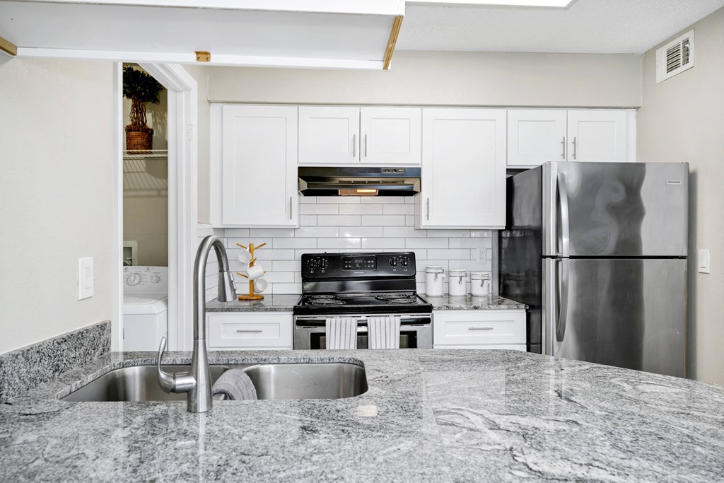 Kitchen with granite counter tops and stainless steel appliances