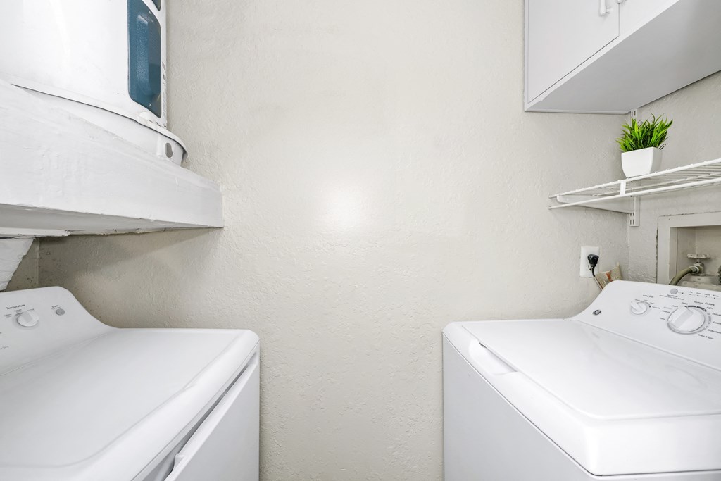 Laundry room has a washer and dryer