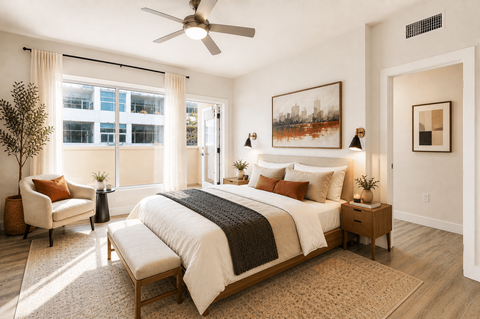 Modern bedroom with natural light and contemporary furnishings at Urbana Apartments, San Diego, California