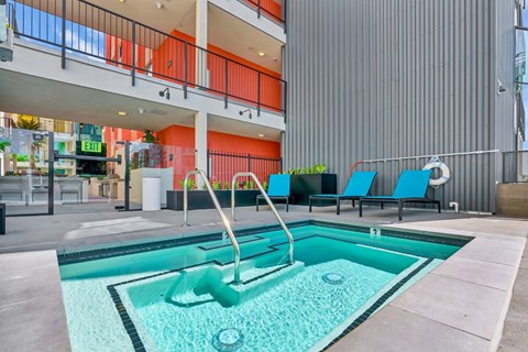 A pool with a slide in the middle of it.