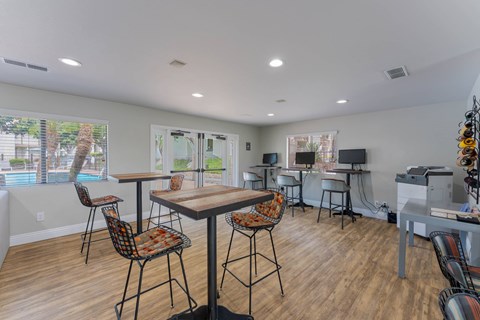 A dining area with a table and chairs is shown.