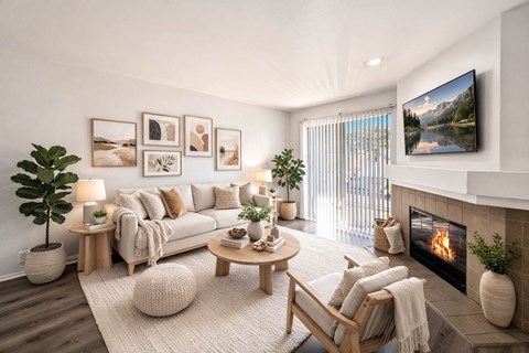 Living room with fireplace and neutral decor at River Front Apartments, San Diego, 92108