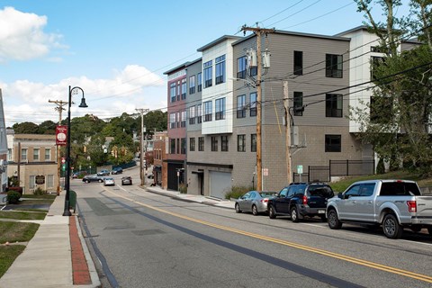 Modern apartment building exterior with street view at Ten Front Apartments, Massachusetts, 02189