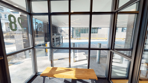 A view from inside a building looking out through a large window.