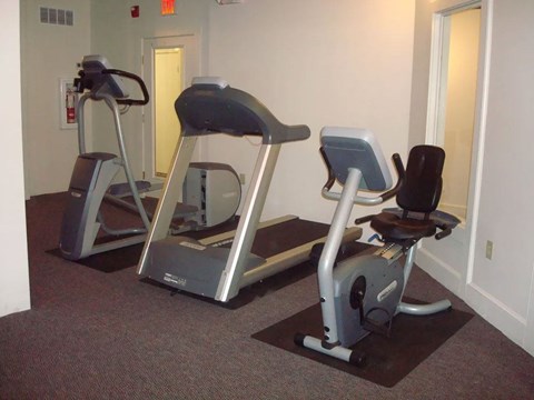 Fitness room with treadmill and recumbent bike at Emerson Shoe Lofts Apartments, Rockland, 02370