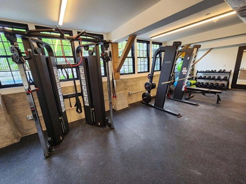 Fitness center with weight training machines at The Overlook Apartments, Weymouth