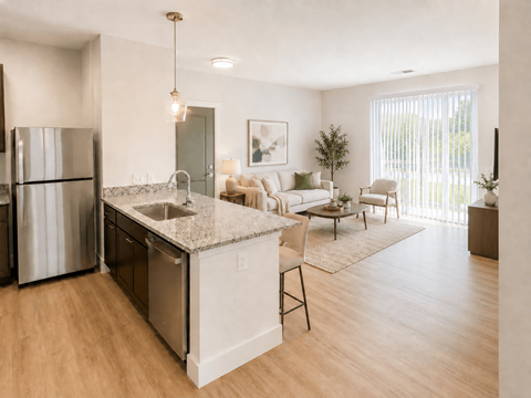 A modern kitchen with a refrigerator, sink, and a dining area with chairs and a table.
