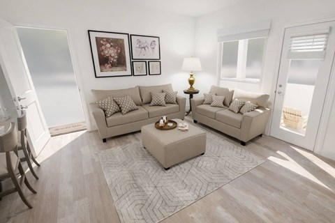 A living room with a beige sofa, a coffee table, and a rug.