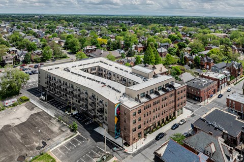 A large building with a parking lot in front of it.