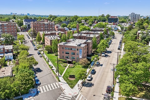 A city street with cars and buildings.