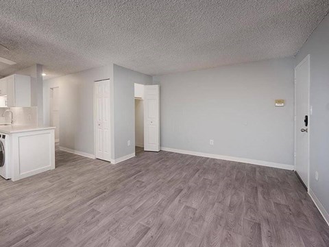 A room with a washer and dryer in it.