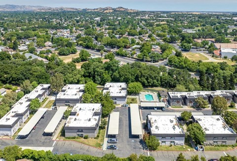 Bird's eye view of a suburban area with a large building at Vacaville Park Apartments, Vacaville, CA, California 