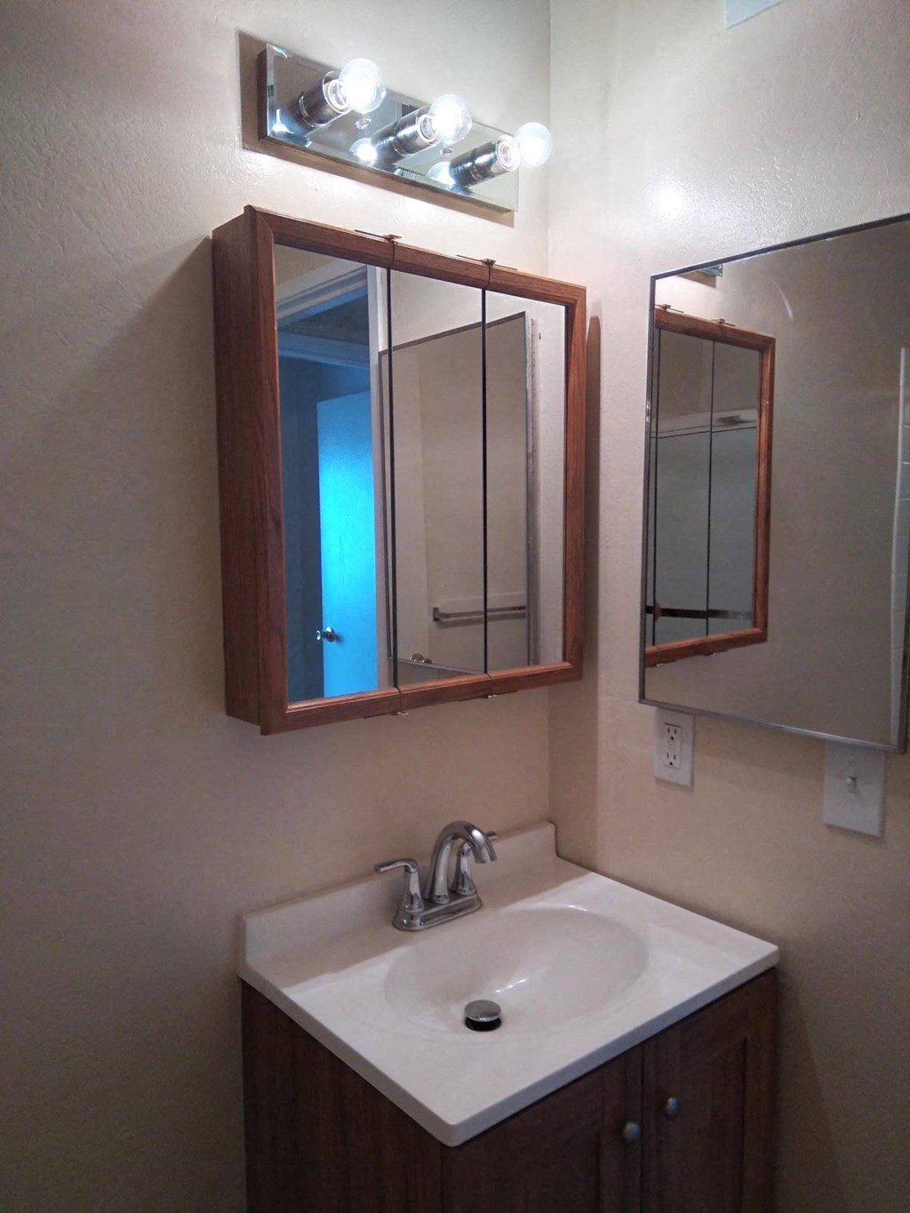 a small bathroom with a sink and a mirror