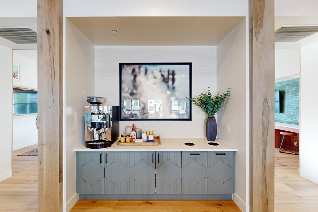 A kitchen with a large painting hanging above the counter at The Villas at Anacapa Canyon, Camarillo, 93012
