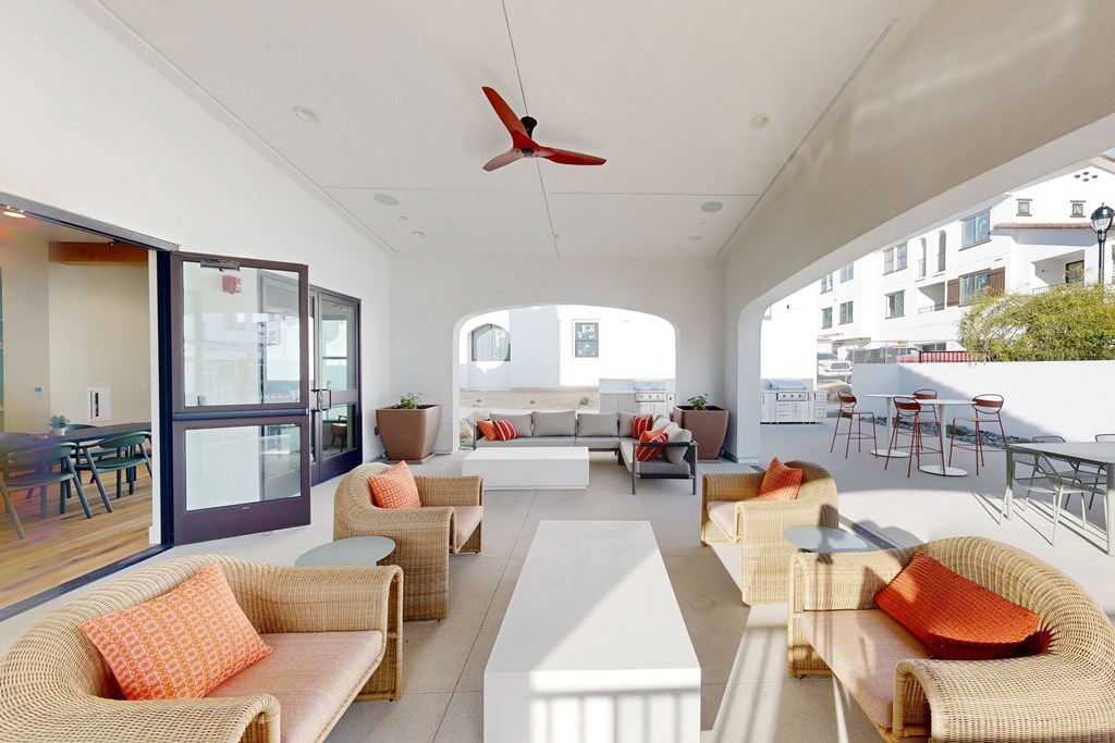 A white patio with orange pillows and a ceiling fan at The Villas at Anacapa Canyon, Camarillo, 93012