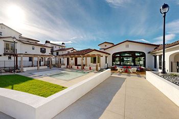 a group of houses with a pool in the middle at The Villas at Anacapa Canyon, California