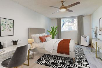 A modern bedroom with a large bed and a ceiling fan at Casa Granada, California, 90049