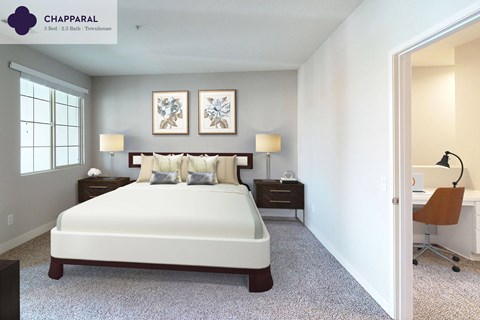 A bedroom with a large bed and two lamps.