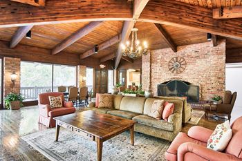 A living room with a fireplace and a couch.