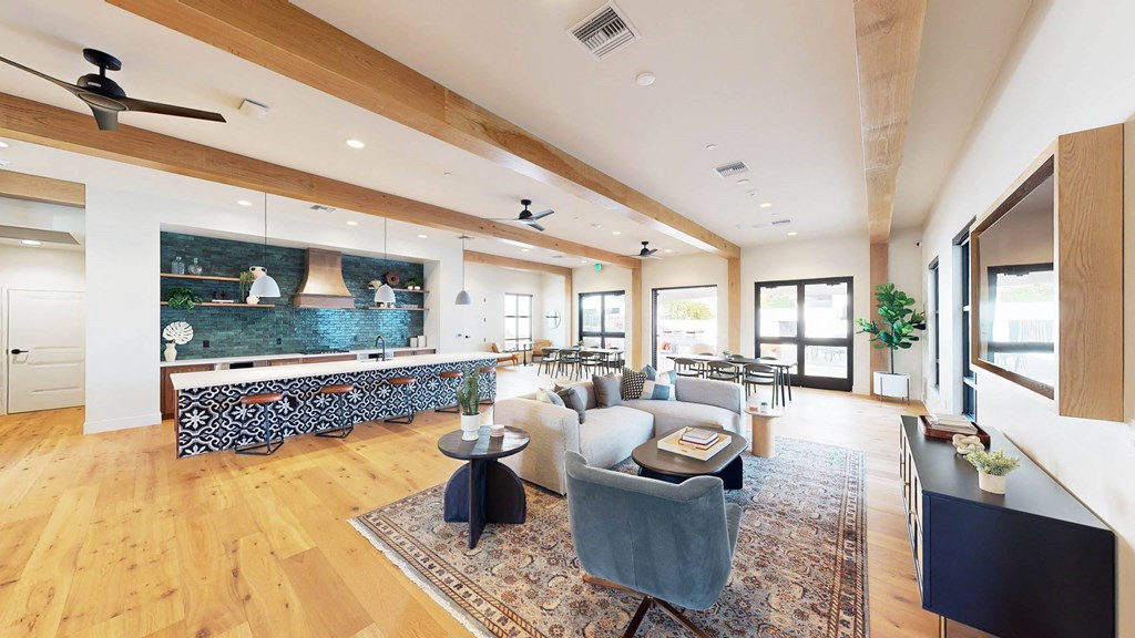 a living room with a couch and a table   and a kitchen at The Villas at Anacapa Canyon, Camarillo