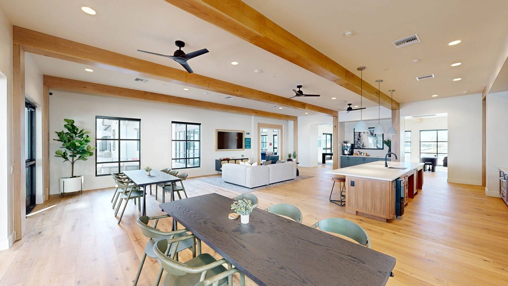 a large living room with a dining room table and a kitchen at The Villas at Anacapa Canyon, Camarillo, 93012