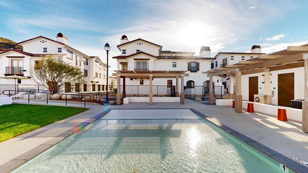 a view of a swimming pool in front of some apartments at The Villas at Anacapa Canyon, Camarillo, California