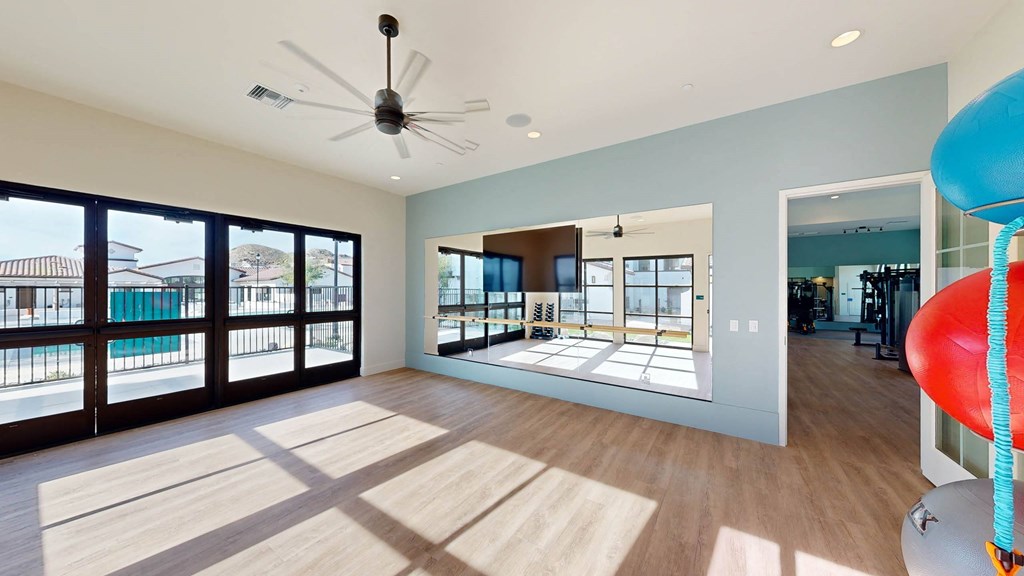 a large room with a pool and a ceiling fan at The Villas at Anacapa Canyon, Camarillo, California