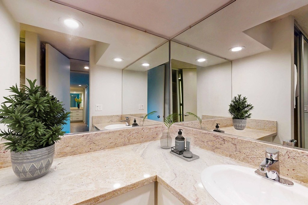 a large bathroom with a sink and a mirror at Casa Granada, Los Angeles, CA