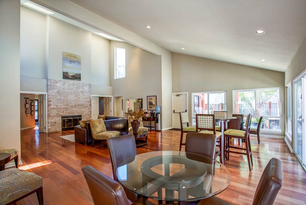 a living room with a glass table and a fireplace at Valley Plaza Villages, Pleasanton, California