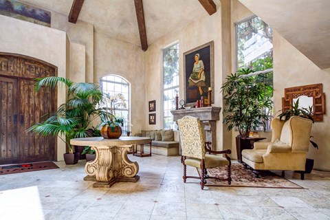 a living room filled with furniture and a table