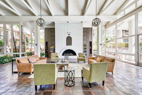 a living room with couches and chairs and a fireplace at Mediterranean Village Costa Mesa, Costa Mesa, 92626