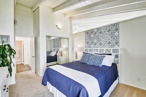 a bedroom with a large bed and a closet at Mediterranean Village Costa Mesa, Costa Mesa, CA, 92626