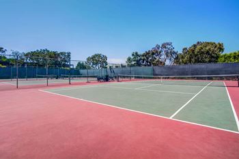 a tennis court with two chairs on it at Mariners Village, Marina del Rey, 90292