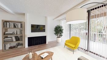 a living room with a yellow chair and a fireplace at Mariners Village, Marina del Rey, 90292