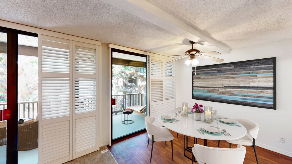 a dining room with a table and chairs and a ceiling fan a dining room with a table and chairs and a ceiling fan at Mariners Village, Marina del Rey, 90292