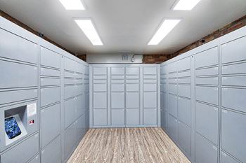 a bunch of white lockers in a room with a wood floor