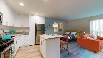 a kitchen and living room with a refrigerator and a table  at Rancho Los Feliz, Los Angeles, 90039