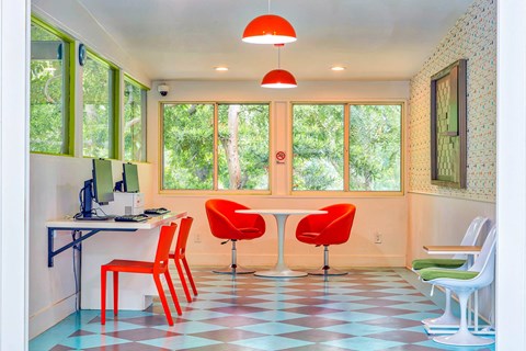 an office with red chairs and a table with a computer  at Rancho Los Feliz, Los Angeles, CA, 90039