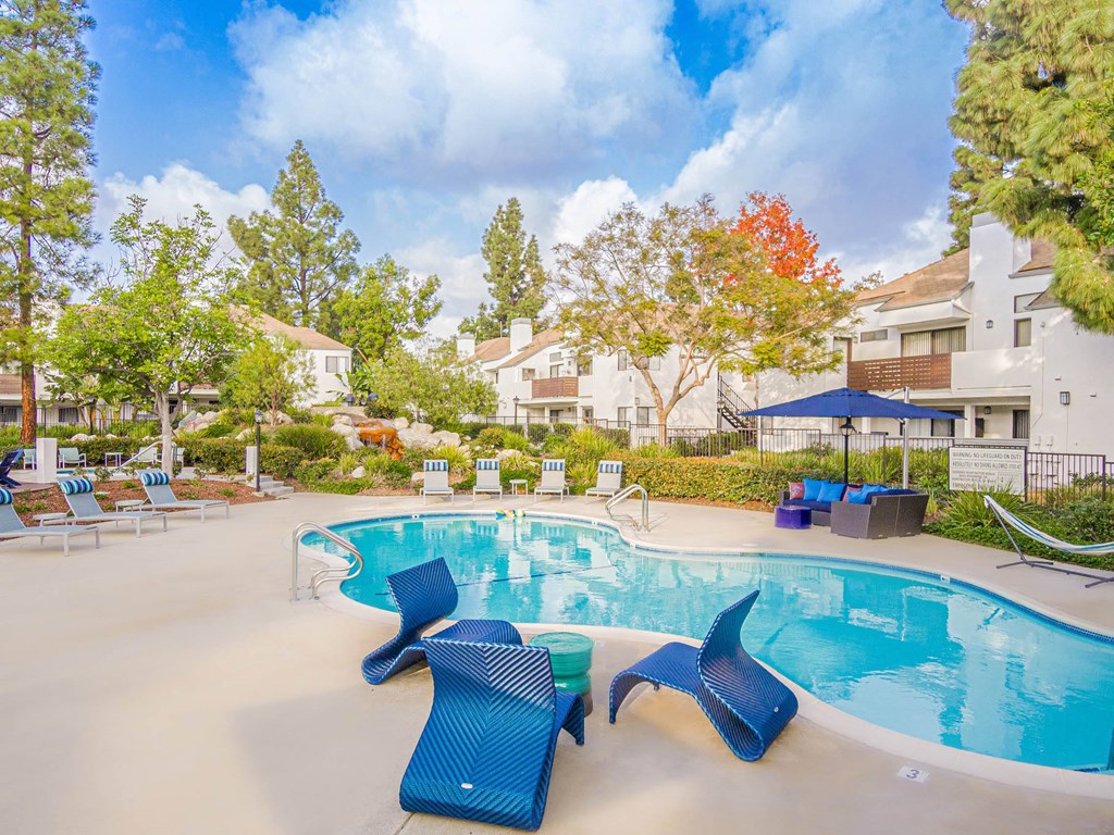 our apartments offer a swimming pool with chairs and umbrellas