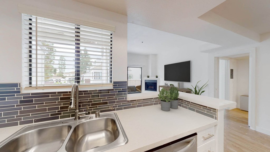 a kitchen with a sink and a window