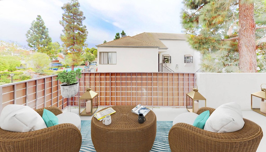 A spacious patio with outdoor lounge furniture