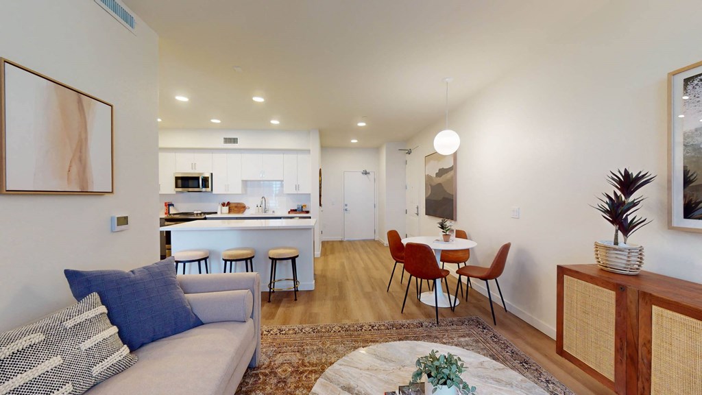 a living room with a couch and a table with chairs at The Villas at Anacapa Canyon, Camarillo, 93012