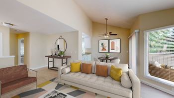 a living room with a couch in front of a window at Valley Plaza Villages, Pleasanton