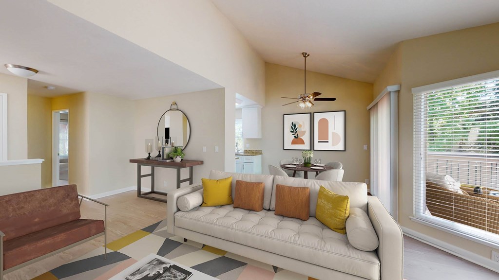 a living room with a couch in front of a window at Valley Plaza Villages, Pleasanton, CA