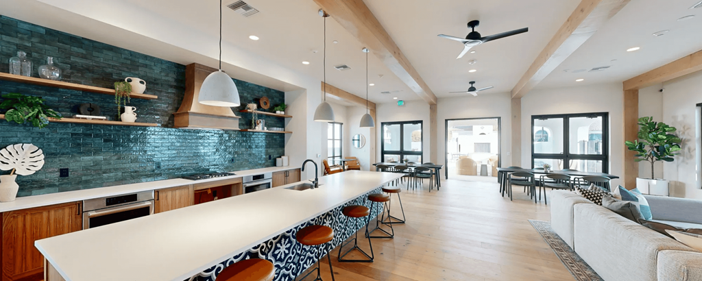 a large kitchen with a long white counter top at The Villas at Anacapa Canyon, California