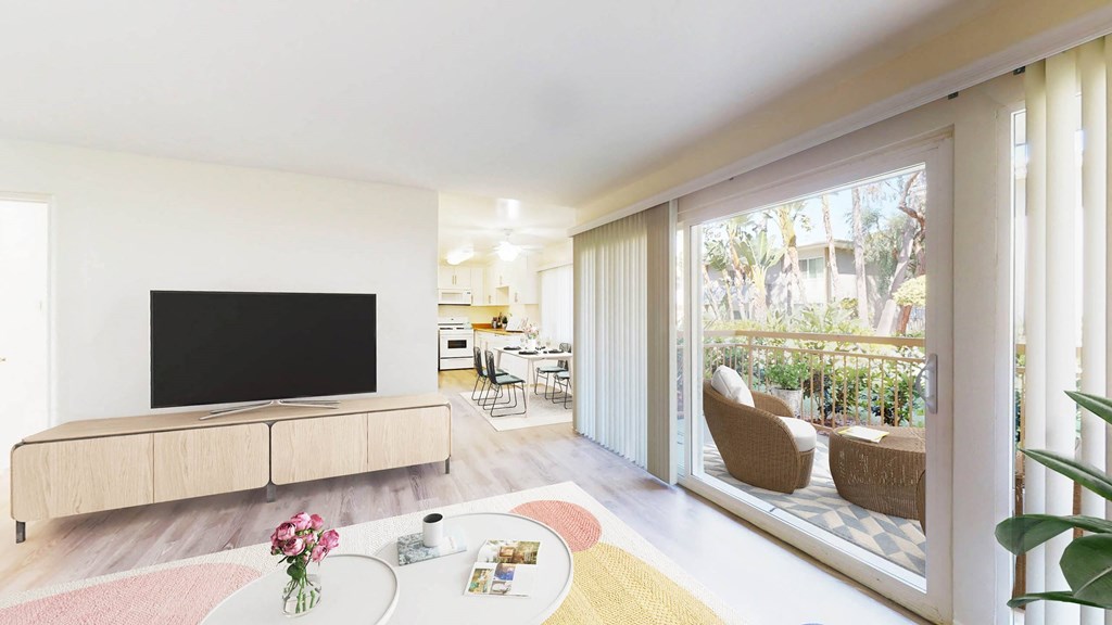 Two Bedroom Plan A - living room, balcony, and dining area at West Park Village Apartment Homes at West Park Village, Los Angeles, California